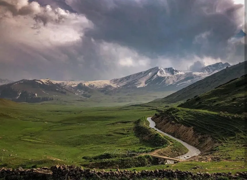 Tosamaidan high alpine meadow valley with winding stream