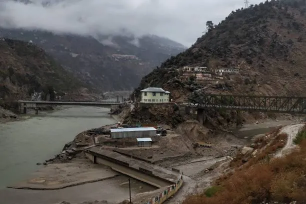 Chenab River rushing through rocky mountain canyon in Doda with bridges