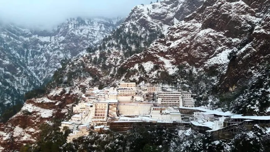 Aerial view of Vaishno Devi Bhawan complex covered in winter snow