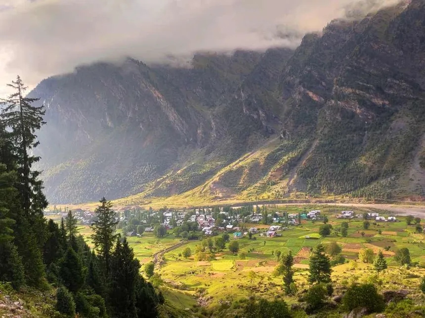 Dawar hamlets in Gurez Valley with dramatic sunlight on Himalayan cliffs
