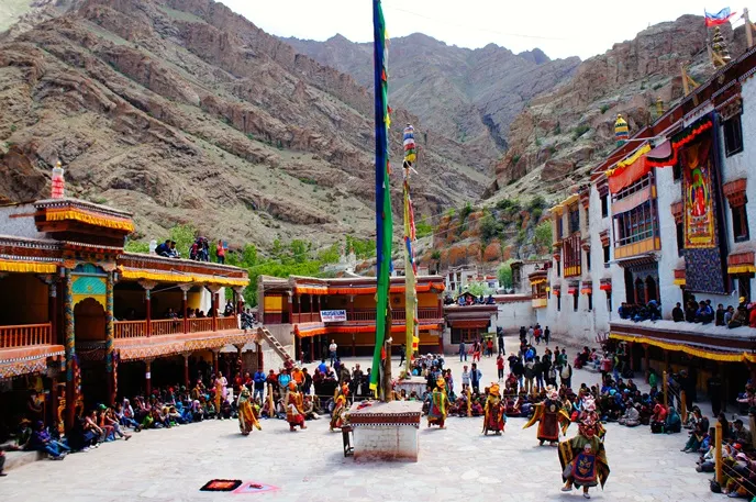 Hemis Gompa courtyard with sacred Cham masked dances and thangkas