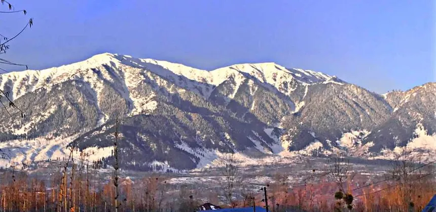 Majestic snow-covered Pir Panjal mountain ridge massif over Poonch