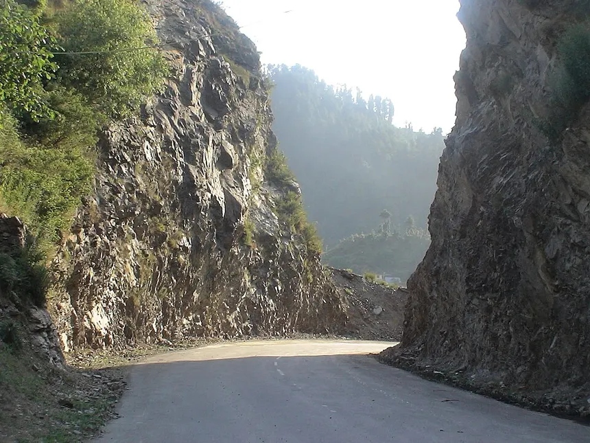 Spectacular rock-cut mountain pass road on Mughal Road in Rajouri