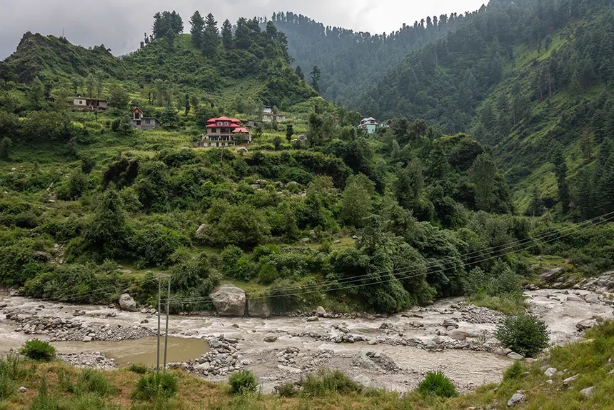Hillside terraced village in Rajouri amidst green corn fields