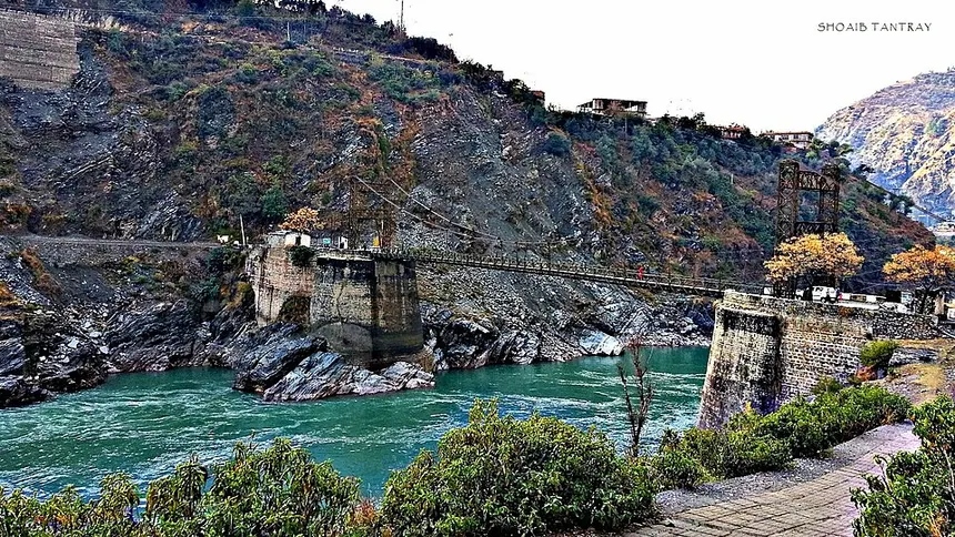 Historic 1890s Ramban suspension bridge over turquoise Chenab River
