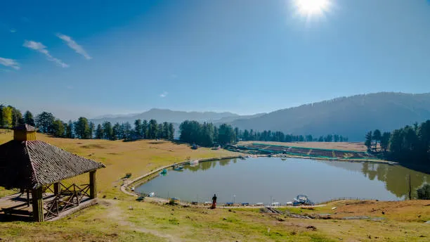 High angle sunny panorama of Sanasar lake with wooden gazebo